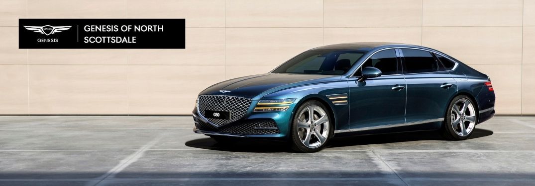 Blue 2021 Genesis G80 Side Exterior in a Driveway with Black and White Earnhardt Genesis of North Scottsdale Logo in Upper Left
