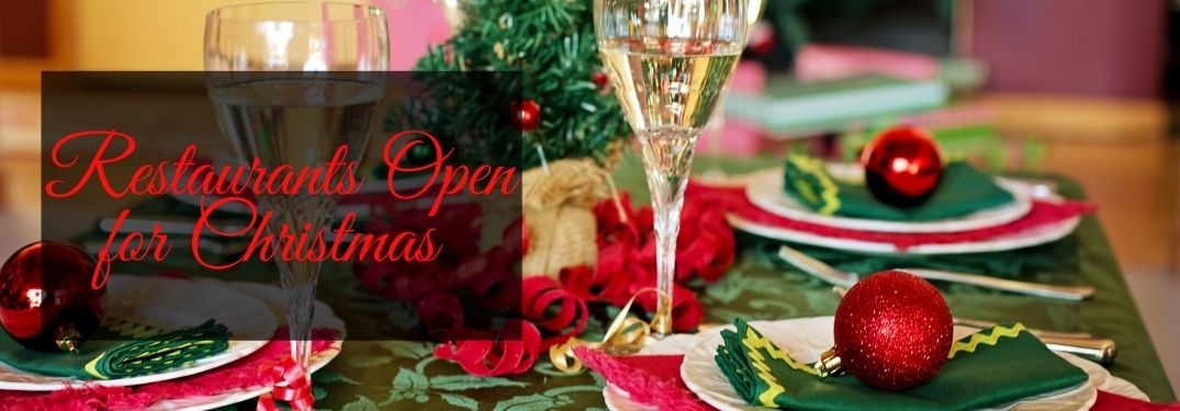 Table Set for Christmas Dinner with Red Restaurants Open for Christmas Text on a Black Background