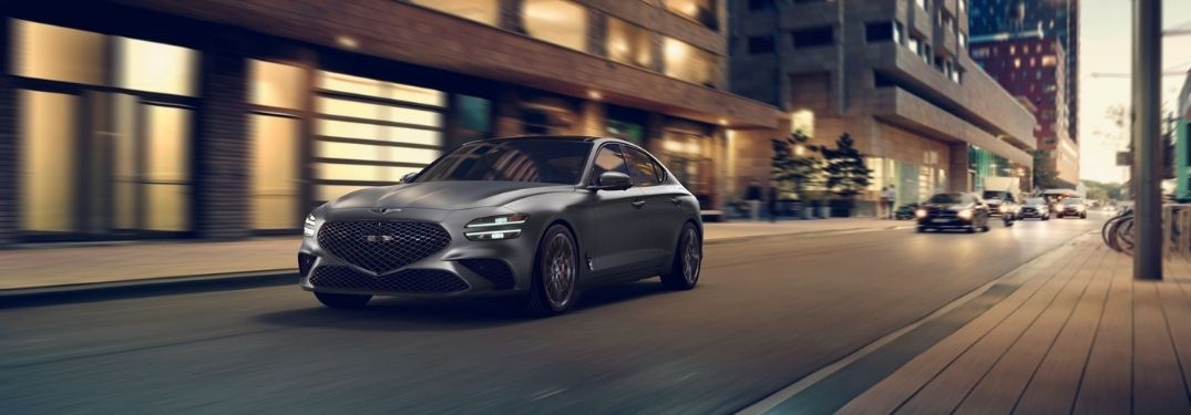 Gray 2022 Genesis G70 on a City Street at Night