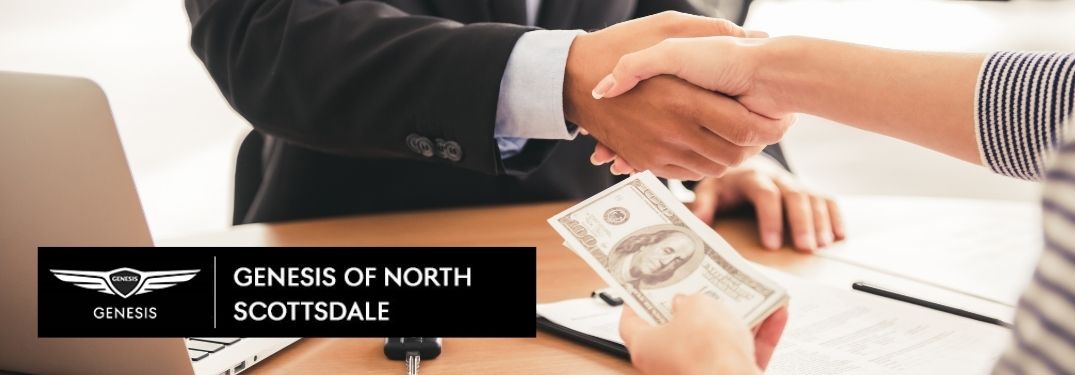 Car Salesman and Customer Exchanging Money and Shaking Hands with Earnhardt Genesis of North Scottsdale Logo