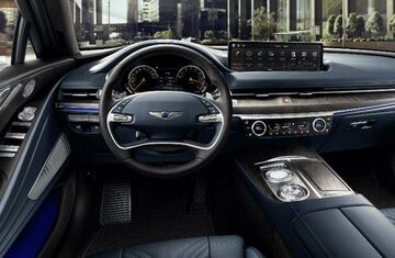 Genesis G80 interior with a large touchscreen display.