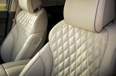 Genesis GV80 leather seats with diamond-patterned stitching.
