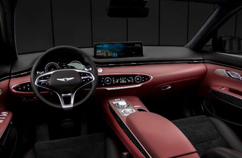 Genesis GV70 interior with a large touchscreen display.