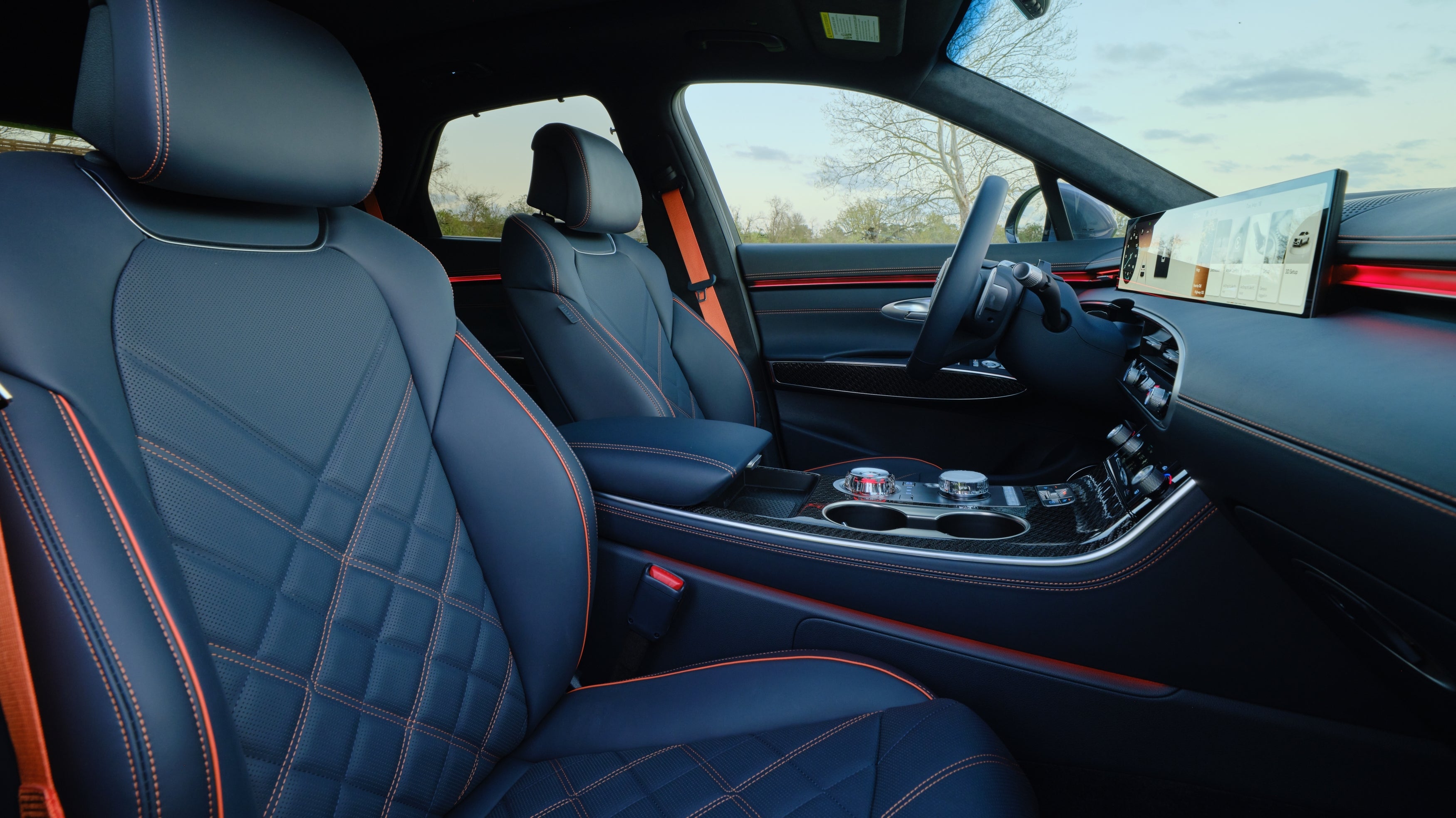 The obsidian black interior is seen in its entirety looking in from the front passenger window of the 2026 Genesis GV70 in Phoenix.