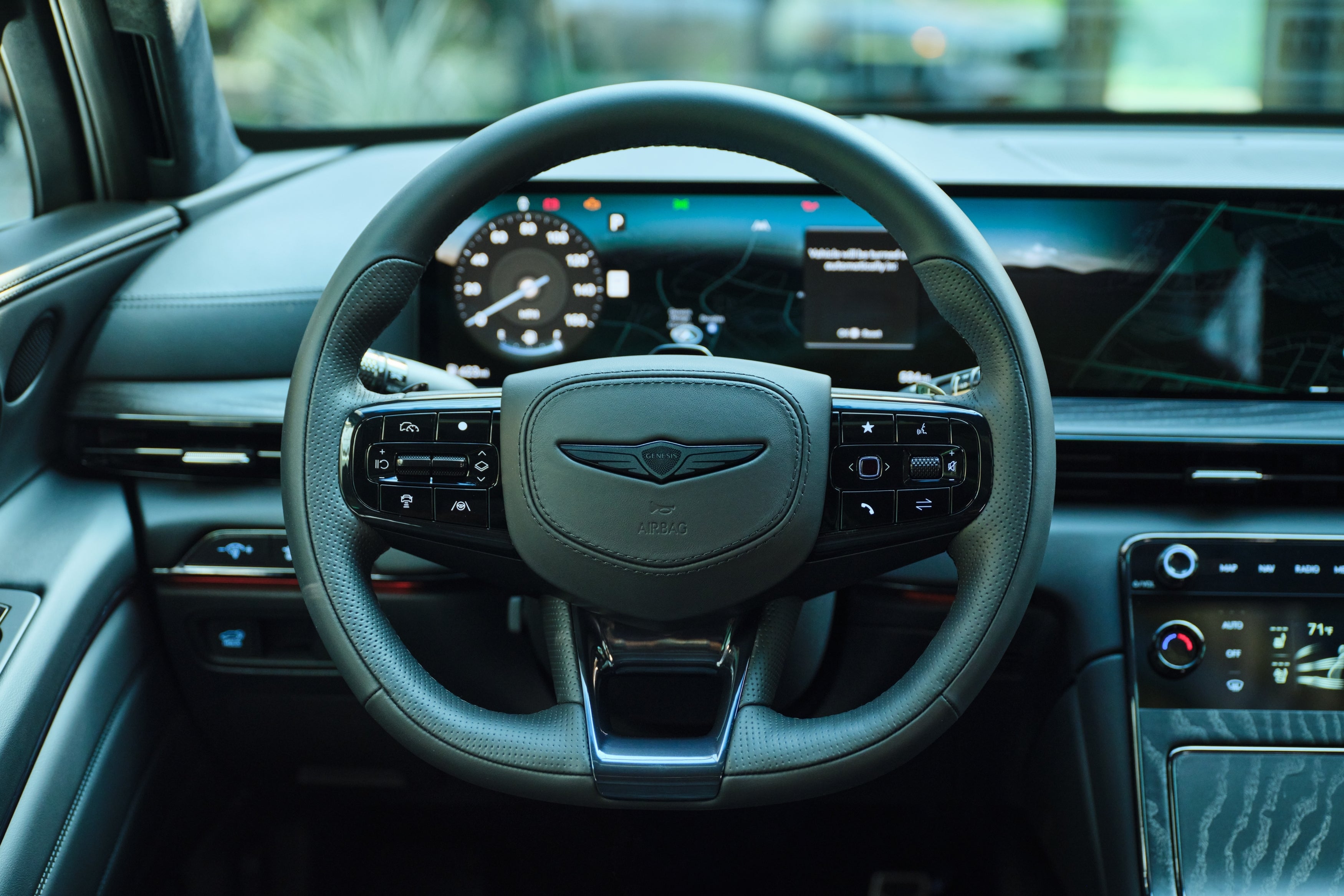 A driver's point of view looking at the steering wheel of the new Genesis GV80 Coupe in Phoenix.