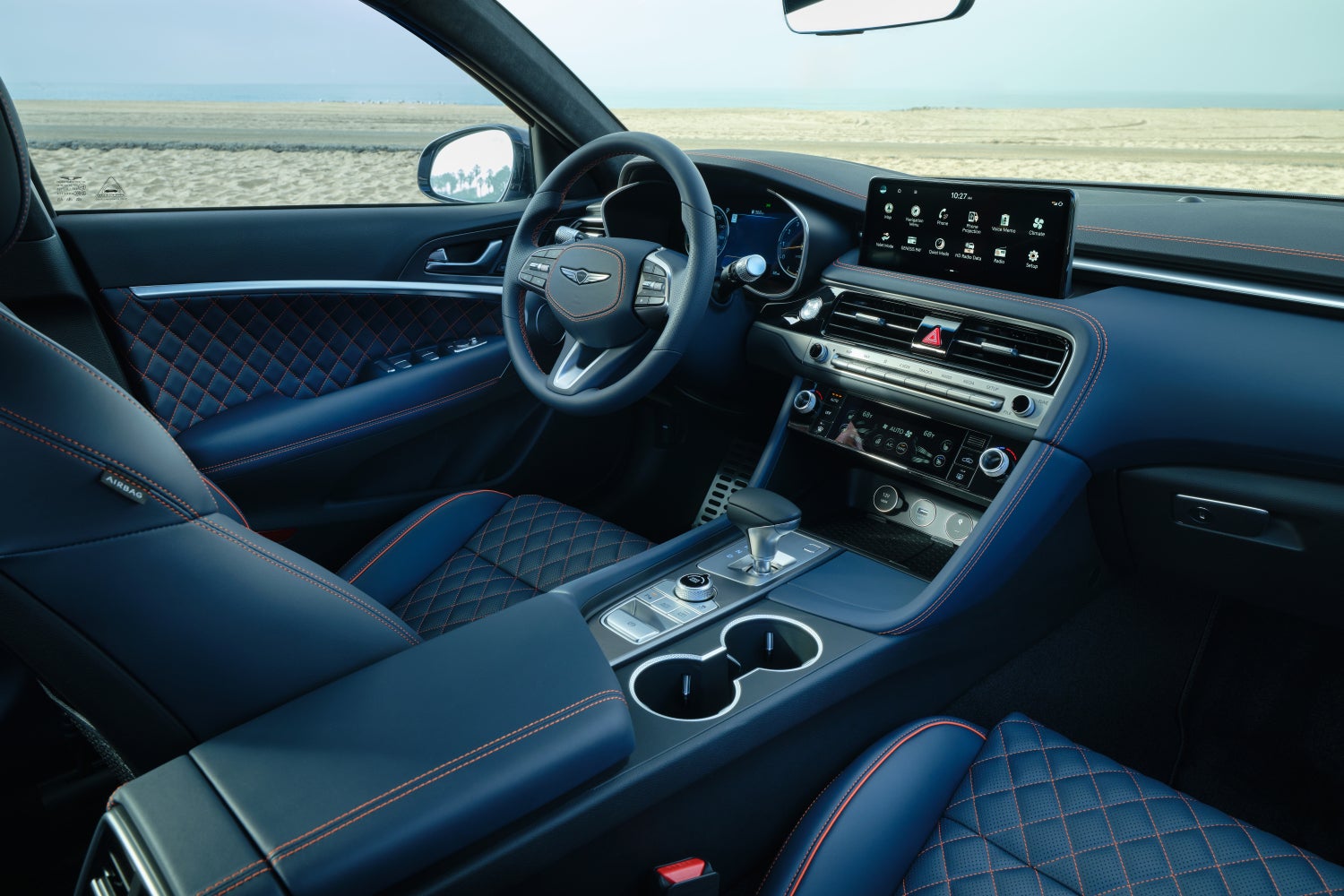 The modern leather interior of the Prestige Graphite 2026 Genesis G70 in Scottsdale is shown.