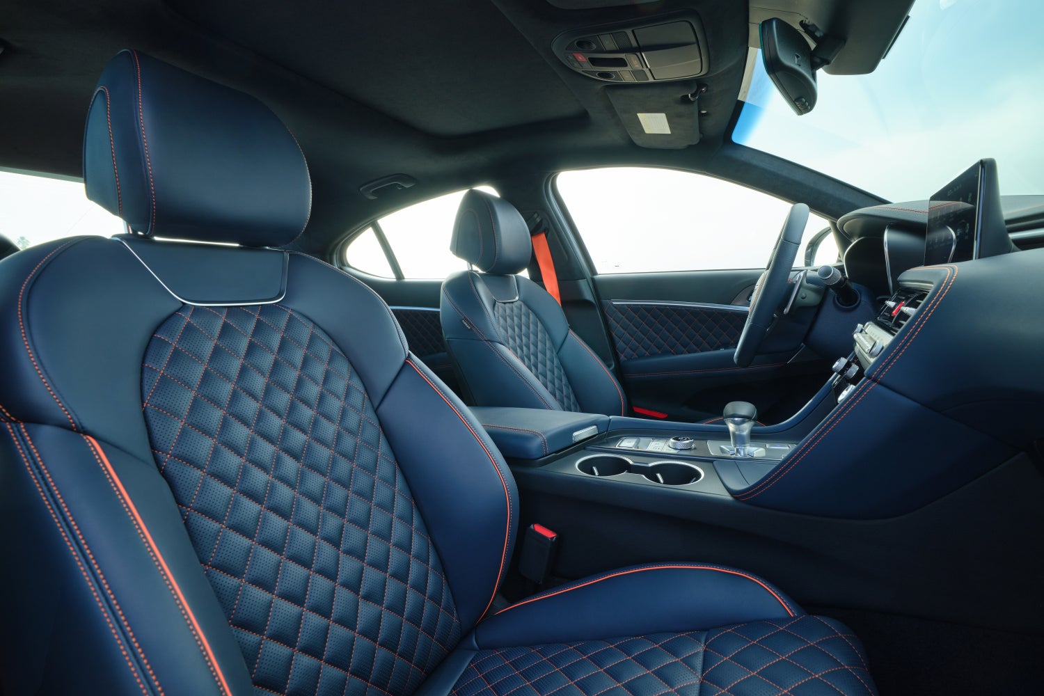 The obsidian black interior of the new Genesis G70 in Scottsdale is seen in its entirety looking in from the passenger window.