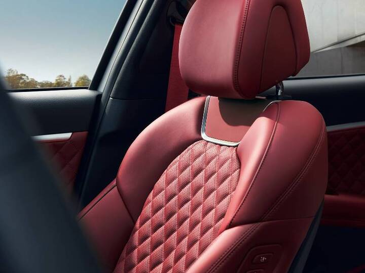Red leather seat with diamond-patterned stitching in a Genesis GV70.