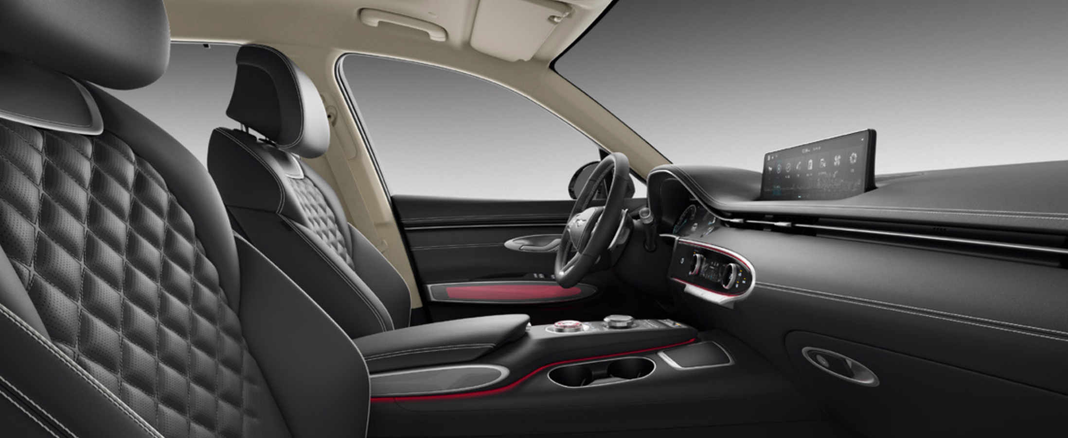 Genesis GV70 interior with black leather seats and red accents.