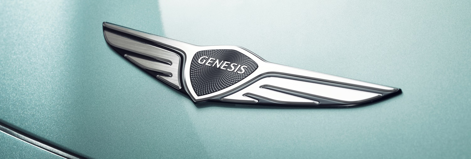 The Genesis logo, featuring a shield with wings and the word "Genesis" inscribed.